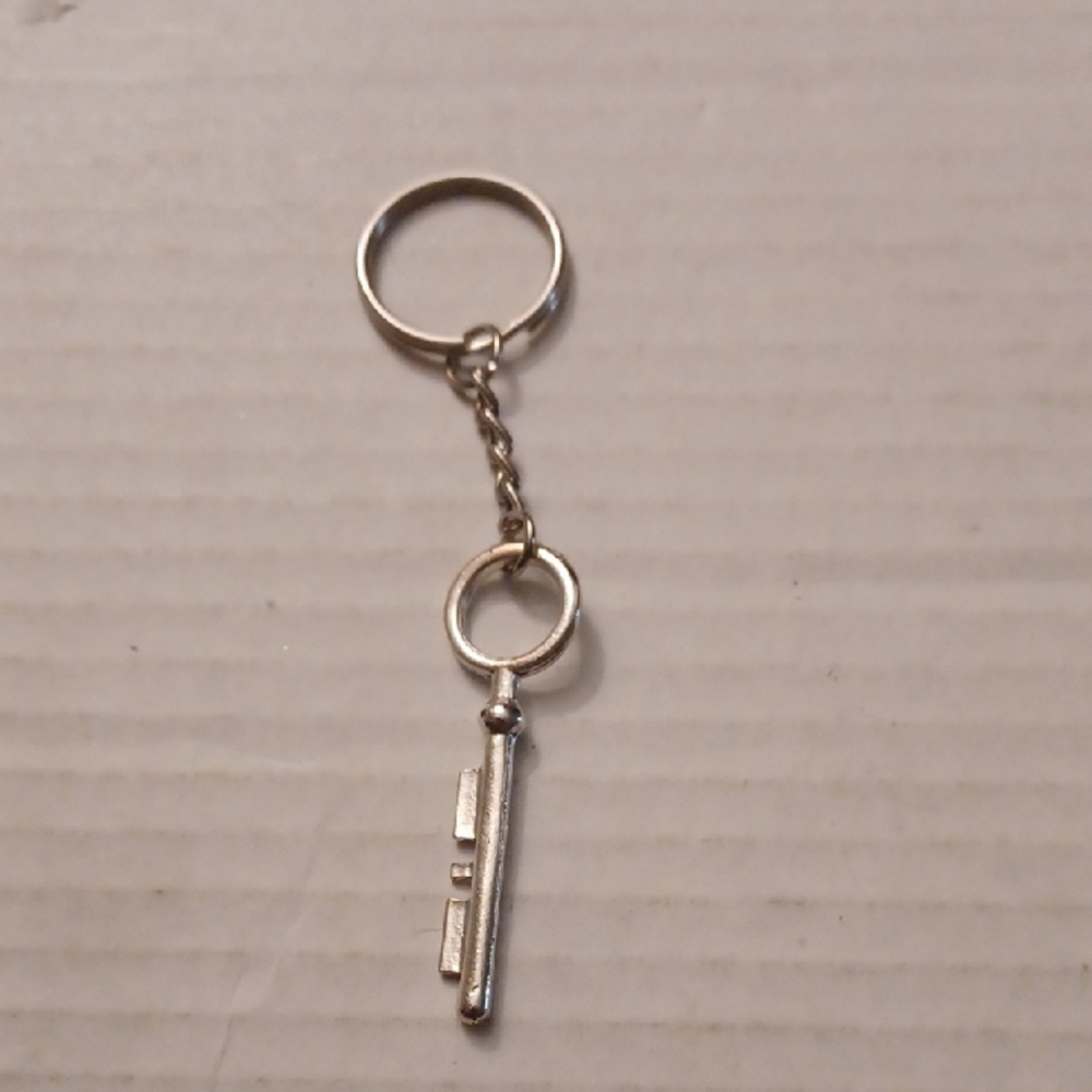 4/$40 New Silver Key Shaped Keychain